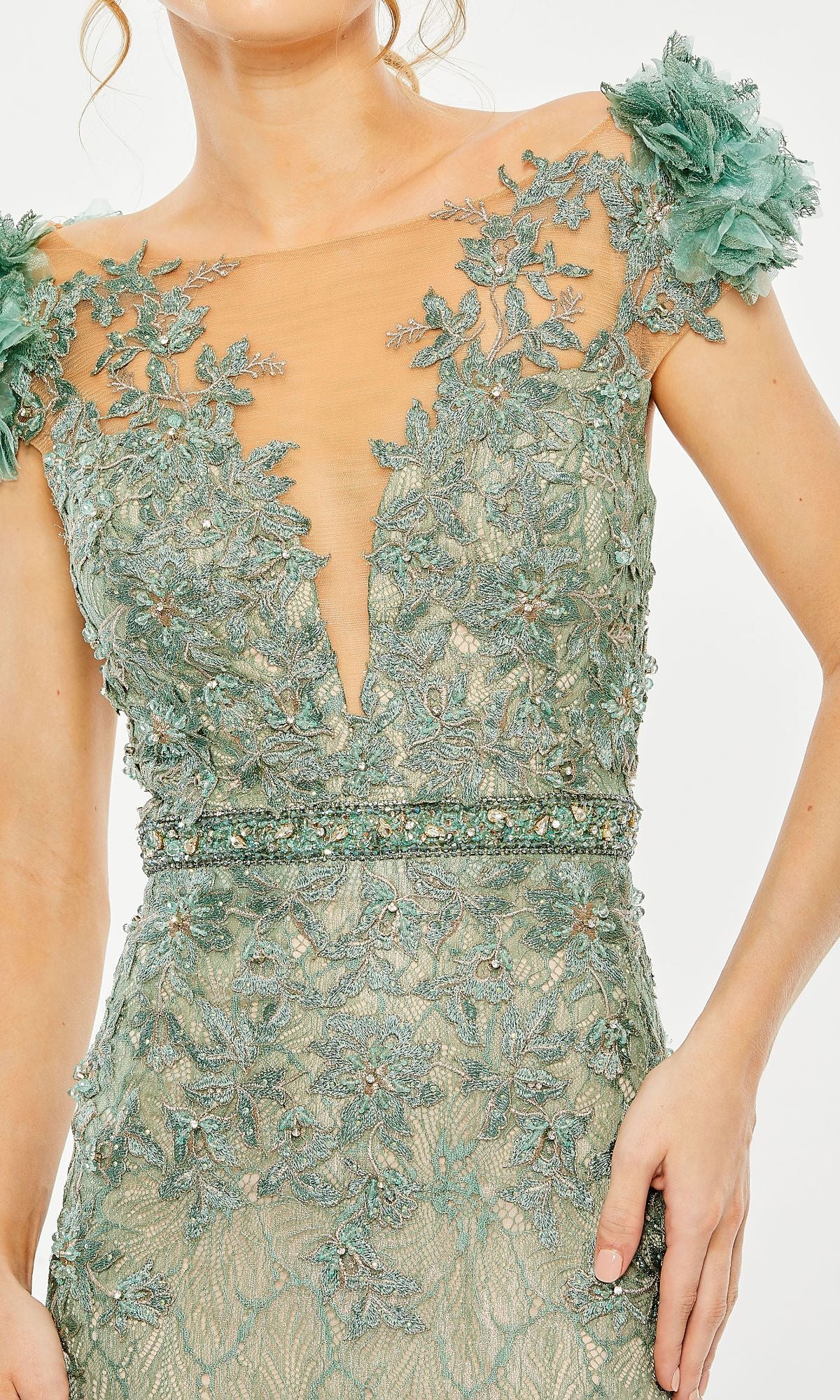 Woman wearing Cap-Sleeve Long Formal Dress: Mac Duggal 79368—a green lace gown featuring floral embroidery, sheer neckline, beaded waist, and floral shoulder appliqués.